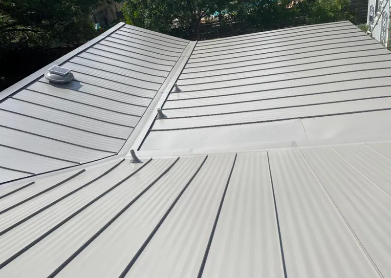 Solar attic fan installed on a metal roof for Roof Ventilation in Westminster